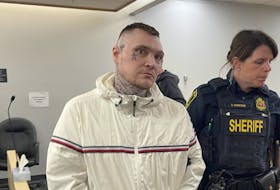 Sheriffs escort Philip Pynn from a provincial courtroom in St. John's Tuesday afternoon, June 6. Pynn, Joe Aylward and Jeff Aylward are on trial for extortion and kidnapping, though the Crown has asked for a mistrial in the case. - SaltWire