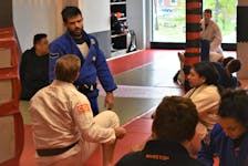 Truro native and accomplished Brazilian Jiu-Jitsu athlete Jake MacKenzie providing instruction to those participating in a recent training session at the Truro BJJ club on Prince Street. MacKenzie and his wife Melissa Britez Costa recently opened their own gym in Halifax. Richard MacKenzie