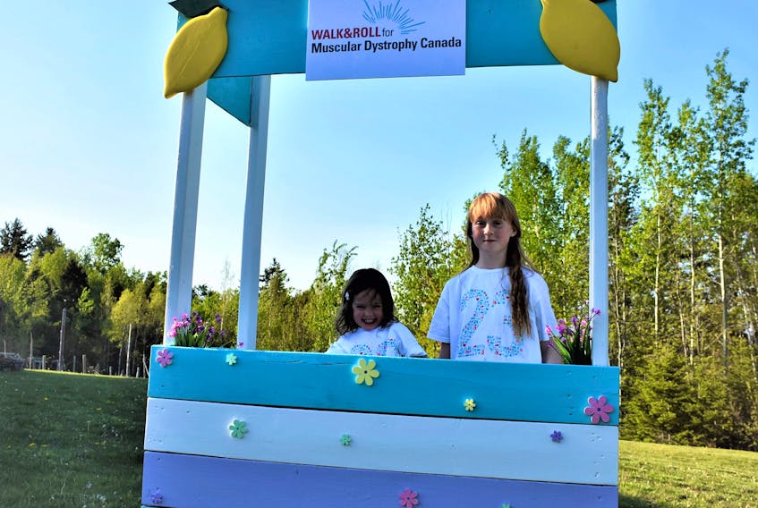 Three-year-old Makayla and 11-year-old Lily are cousins and this year are the Ambassadors for the Pictou County Walk and Roll. They’re pictured in the lemonade stand Lily’s dad made to help them fundraise and which will be set-up at different events around the county during the lead-up to the June 17 event. Richard MacKenzie