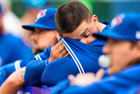 Alek Manoah of the Toronto Blue Jays wipes his brow in the dugout after getting pulled in the first inning against the Houston Astros at the Rogers Centre on June 5, 2023.