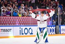 Latvia's goalkeeper Arturs Silovs celebrates after winning the IIHF Ice Hockey Men's World Championships third place play-off match betweeen United States and Latvia in Tampere, Finland, on May 28, 2023.