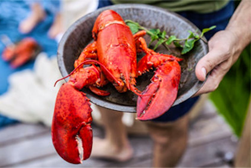 Lobster Prince Edward Island will be partnering with over 50 locally owned businesses across P.E.I. as part of the new Legendary P.E.I. Lobster Crawl, showcasing lobster-themed restaurant dishes, retail shipment process, excursions and other events. Stock Image