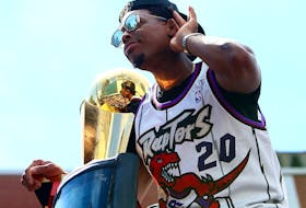 Kyle Lowry of the Toronto Raptors holds the championship trophy during the team's victory parade on June 17, 2019 in Toronto. 