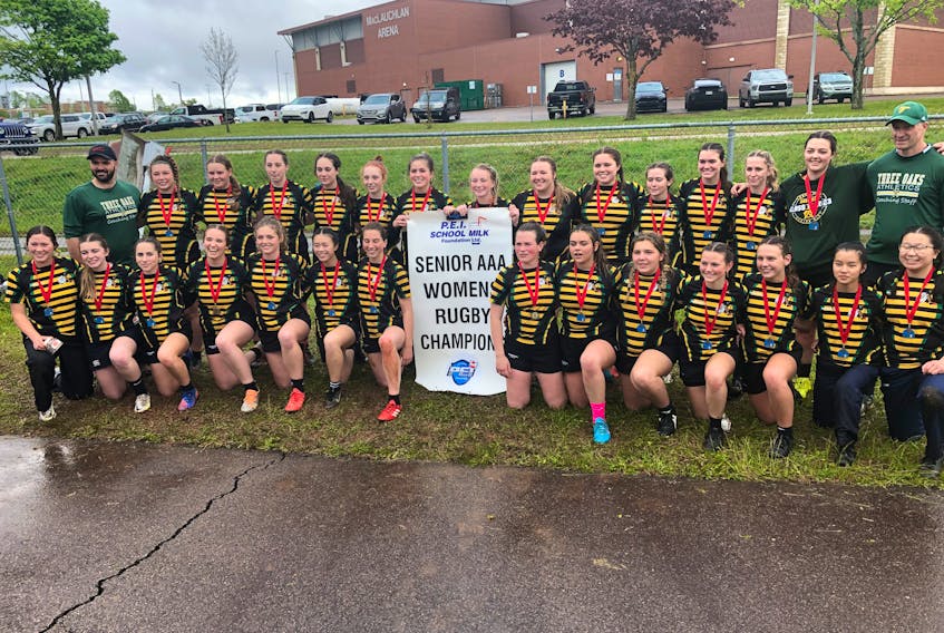 The Three Oaks Axewomen won their third P.E.I. School Athletic Association Senior AAA Girls Rugby League championship in a row on June 6. The Axewomen defeated the Charlottetown Rural Raiders 20-10 at UPEI’s MacAdam Field. Members of the Axewomen are, front row, from left, Chloe Campbell, Sydney Cameron, Bree McAlduff, Lucie Mills, Isabel MacLellan, Lana Gillis, Deirdre Studer, Maddy Dyer, Becca Minten, Ami Beaulieu, Katie-Grace Noye, Dru Gillis, Jaida Clow and Kennedy Clow. Back row, from left, are Brent Woodside (assistant coach), Sydnee Bernard, Karli Snow, Bella MacKinnon, Marleigh-Jane Smallwood, Payton Maund, Jessee Hill, Olivia James, Victoria Thornhill, Oxanna Campbell, Ava Pomeroy, Kailyn Gallant, Ava Allain, Faith Brown and Tim Hockin (head coach). Jason Simmonds • The Guardian