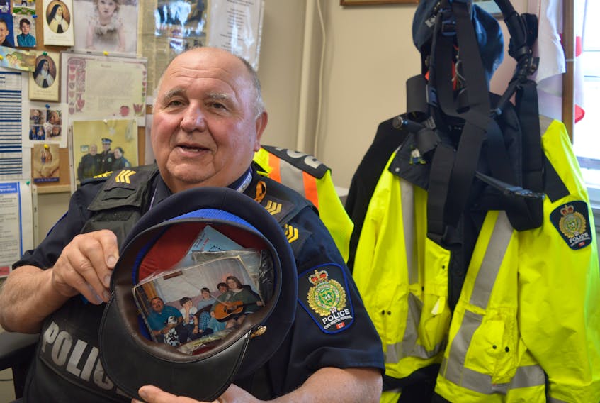 Cape Breton Reginal Police Sgt. Barry Gordon has kept his family close to him while on the job — a photo duct taped inside his his hat. BARB SWEET/CAPE BRETON POST