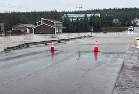 The Town of Roddickton-Bide Arm has been split in two after the brook that runs through the centre of town has flooded over the road and is washing it away. - Contributed