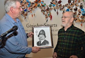 Summerside and Area Historical Society president Rick Milligan presents the Gerard Gallant Award to Randall Ross during the society's annual general meeting on Sunday, May 28. Ross was honoured for his advocacy and commitment to preserving history in Summerside. - Kyle Reid