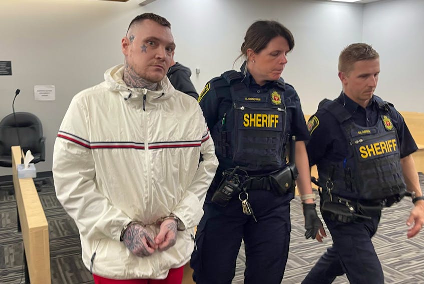 Sheriffs escort Philip Pynn from a provincial courtroom in St. John's Tuesday afternoon, June 6. Pynn, Joe Aylward and Jeff Aylward are on trial for extortion and kidnapping, though the Crown has asked for a mistrial in the case. SALTWIRE PHOTO