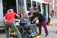 MacLeod Group Health Services employees help Merton Swansburg board a bus home to Lockeport June 9 at Acadia University in Wolfville. Residents from two Shelburne County nursing homes stayed at a residence on campus after being evacuated due to wildfires.
Jason Malloy