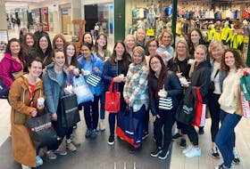 Staff at Orthodontic Associates in St. John's thought they were attending a "tissues and issues" staff meeting, but were instead thanked for their hard work with a shopping spree at the Avalon Mall. - Facebook
