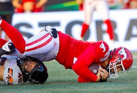 Calgary Stampeders QB Jake Maier is tackled by B.C. Lions Ben Hladik in second half CFL action at McMahon stadium in Calgary on Thursday, June 8, 2023. The Lions defeated the Stamps 25-15. Darren Makowichuk/Postmedia