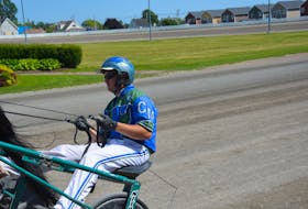 Corey MacPherson warms up a horse at Red Shores at Summerside Raceway on July 9. MacPherson registered a driving hat trick on the July 11 program in Summerside. Jason Simmonds • The Guardian