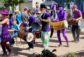 The Deep Roots Festival's annual Fresh Beats Rhythm Parade in Wolfville invites the public to join in the music-making with costumes and handmade instruments. Photo credit: Anne S.