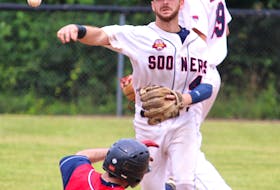 Sydney Sooners shortstop Chris Farrow throws to first as Kentville Wildcats Matt Johnston tries to break up the double play attempt during senior baseball action July 15 at Kentville Memorial Park.