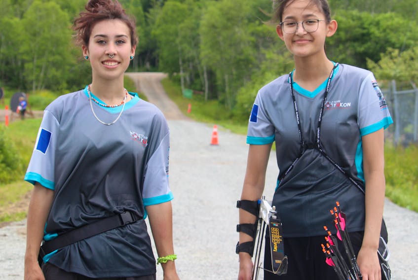 Archers Pheonix Widney, left, and Mya Wilson did some target practice at the Millbrook Powwow Grounds on July 17 in preparation for the start of competition at the North American Indigenous Games competition. They're competing with Team Yukon. Brendyn Creamer