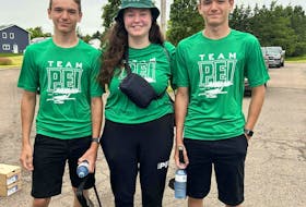 Keely Dyment, centre, joins her twin brothers, Riley, left, and Reece before Team P.E.I. travelled to Halifax for the 2023 North American Indigenous Games (NAIG) on July 16. Keely, a former bronze-medallist for Team P.E.I., is now Team P.E.I.’s sport manager while Reece and Riley will be competing in badminton. Team P.E.I. • Special to The Guardian