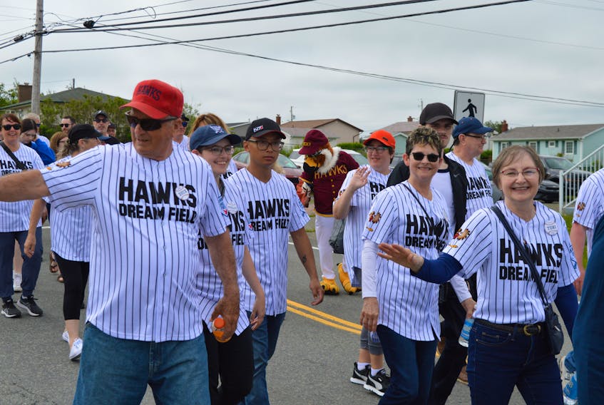 Some members of the Hawks Dream Field committee march in the parade Sunday prior to the accessible and inclusive field's grand opening. At right isToni McNeil, whose late husband Walter's legacy inspired the movement to create the field. BARB SWEET/CAPE BRETON POST