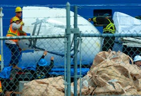 Pieces of the destroyed Titanic dive submersible Titan are unloaded from the Horizon Arctic and placed on a truck after the ship arrived in St. John’s on June 28, 2023. Keith Gosse/The Telegram