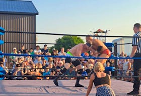 Jason Boa, left, and Mikey Rave, right, who both fight for Island Power Wrestling compete in front of a live audience in Summerside. Contributed