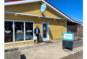 Business owner, Brenna MacNeil stands in front of her shop, The Corner Store by missbrenna, on 15645 Central Avenue in Inverness. PHOTO CREDIT: Cape Breton Partnership