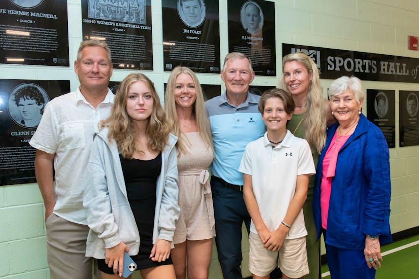 Former Saint Dunstan’s University and UPEI football player Jim Foley recently visited UPEI while vacationing in P.E.I. Foley and his family members check out his plaque at the UPEI Sports Hall of Fame in the Chi-Wan Young Sports Centre. From left are Rod Foley, son; Jordana Hunter, granddaughter; Kathy Foley, daughter-in-law; Jim Foley; Colby Hunter, grandson; Tara Hunter, daughter, and Lesley Foley, wife. Mike Needham, UPEI • Special to The Guardian