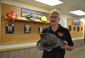 Bridgetown Volunteer Fire Department member Jim MacNeill stands in front of the department’s memorial wall. Times and equipment have changed – they don’t use leather helmets anymore – but the dedication, commitment, and determination have remained the same for 150 years. Lawrence Powell