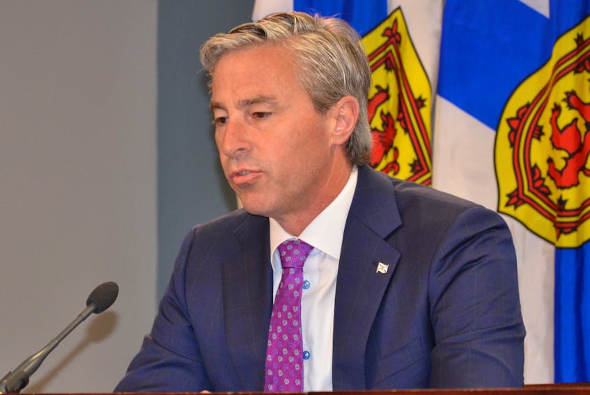 Premier Tim Houston speaks with media on Thursday, July 27, in downtown Halifax. - Francis Campbell