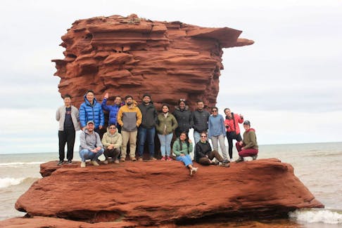 Members of UPEI's Climate Smart Lab pose in front of Teacup Rock. The iconic structure was destroyed by the landfall of Fiona in 2022. - Contributed