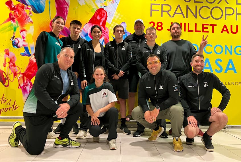 Members of the team that will represent New Brunswick at the ninth Jeux de la Francophonie to be held in Kinshasa, Democratic Republic of the Congo, from July 28 to Aug. 6, include, first row, from left: wrestling coach Don Ryan, wrestler Tania Blanchard, mission staff member Armand Doucet and Pierre-André Doucet, who is representing the province in literature; and second row, from left: wrestlers Elena Sehic, Koen Poirier, Vivian Kutnowski and Jonathan Sherrard, assistant wrestling coach Jeff Allen, wrestler Raymond Hazell and Guillaume Lépine, who is representing the province in painting. Contributed