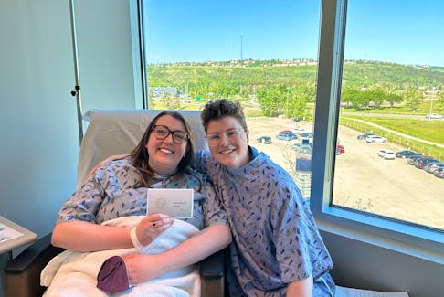 Kelsey Puddister (left) and her spouse, Julia Collins, in Calgary as Puddister received fertility treatments. Contributed