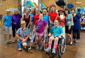 Easter Seals P.E.I. ambassadors Katelyn Rogers, front centre, and Meghan Rogers, front right, helped treat over 1400 cruise passengers to a flash mob dance performance at Port Charlottetown on Tuesday, July 4. Contributed