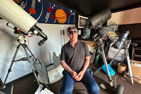 Legally blind Yarmouth astronomer visits summit of Hawaii volcano to operate telescope