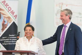 Premier Tim Houston shares a laugh with Kathleen Mitchell, noard president, Akoma Holdings Inc., at an announcement for a new long-term care facility in Westphal on Wednesday, July 5, 2023.