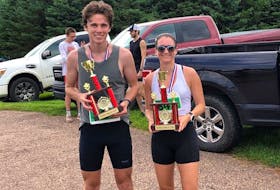 Jack Roberts, left, and Sandra Cottreau were the top male and female runners in the 46th Dunk River Road Race in Bedeque on July 29. Roberts finished the 7.3-mile course first overall in 48 minutes 58 seconds (48:58) and Cottreau was second overall with a time of (49:54).