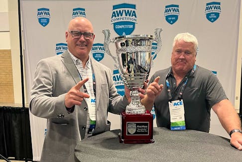 City of Miramichi engineering director Darren Row, left, and public works director Jay Shanahan accept the first place prize on behalf of the municipality from the American Water Works Association's Best of the Best Water Taste Test in Toronto on June 13. Contributed