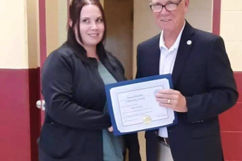 Holly Lawrence (left) was present with an award by the town of Westville for her actions saving a man during the Canada Day Parade. Mayor Lennie White (right) presented the award to her.