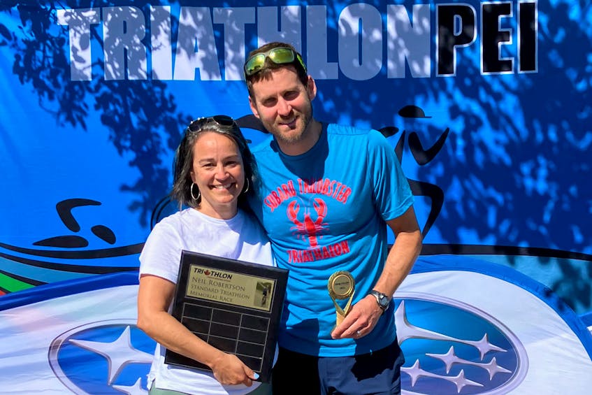 Kathy Robertson congratulates Tyler Reid, winner of the 2022 event that features the name of her husband – Neil Robertson Standard Triathlon Memorial race. The event was held as part of the Subaru of Charlottetown TriLobster Triathlon. Neil, one of the founding fathers in triathlon in P.E.I., died shortly before the event.