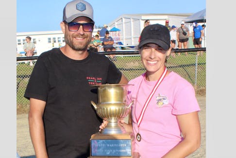Mixed 1 team captain Marissa Bourque received the championship trophy presented by Marc LeBlanc, president of the 16th annual Wedgeport Acadian Families Lob-Ball Tournament. CONTRIBUTED