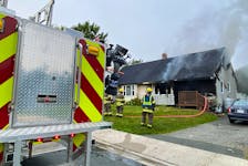 When firefighters arrived to the scene of a structure fire on Hoyles Avenue just after 7 a.m. on Friday, August 18, one side of a duplex was engulfed in smoke and flames. — Keith Gosse/SaltWire