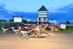 Scott Young drives Funatthebeach N, 4, to victory in a Gold Cup and Saucer Trial at Red Shores Racetrack and Casino at the Charlottetown Driving Park on Aug. 12. Roll Em, 1, and driver Marc Campbell finished second while the Gilles Barrieau-driven Twin B Tuffenuff, 2, finished in the show position. The $100,000 Atlantic Lottery Gold Cup and Saucer final goes in Charlottetown on Aug. 19. Gail MacDonald Photo • Special to The Guardian