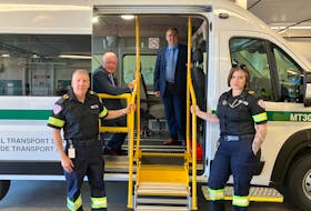 EMT Chris Farmer, left, Health Minister Bruce Fitch, Ambulance New Brunswick vice-president Edgar Goulette and EMT Kelsey Savoie marked the announcement of New Brunswick using emergency medical technicians (EMTs) and multi-patient vehicles for non-urgent transfers at the Gorge Road location in Moncton. Contributed