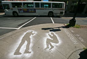 Aug. 6, 2007--Two outlines of peope are painted on the corner of Barrington and Prince Streets Monday marking the 62nd anniverary of the bombing of Hiroshima, Japan, by a nuclear bomb during World War II. The city of Nagasaki was bombed three days later. Both bombs killed more than 200,000 people but brought the surrender of Japan.