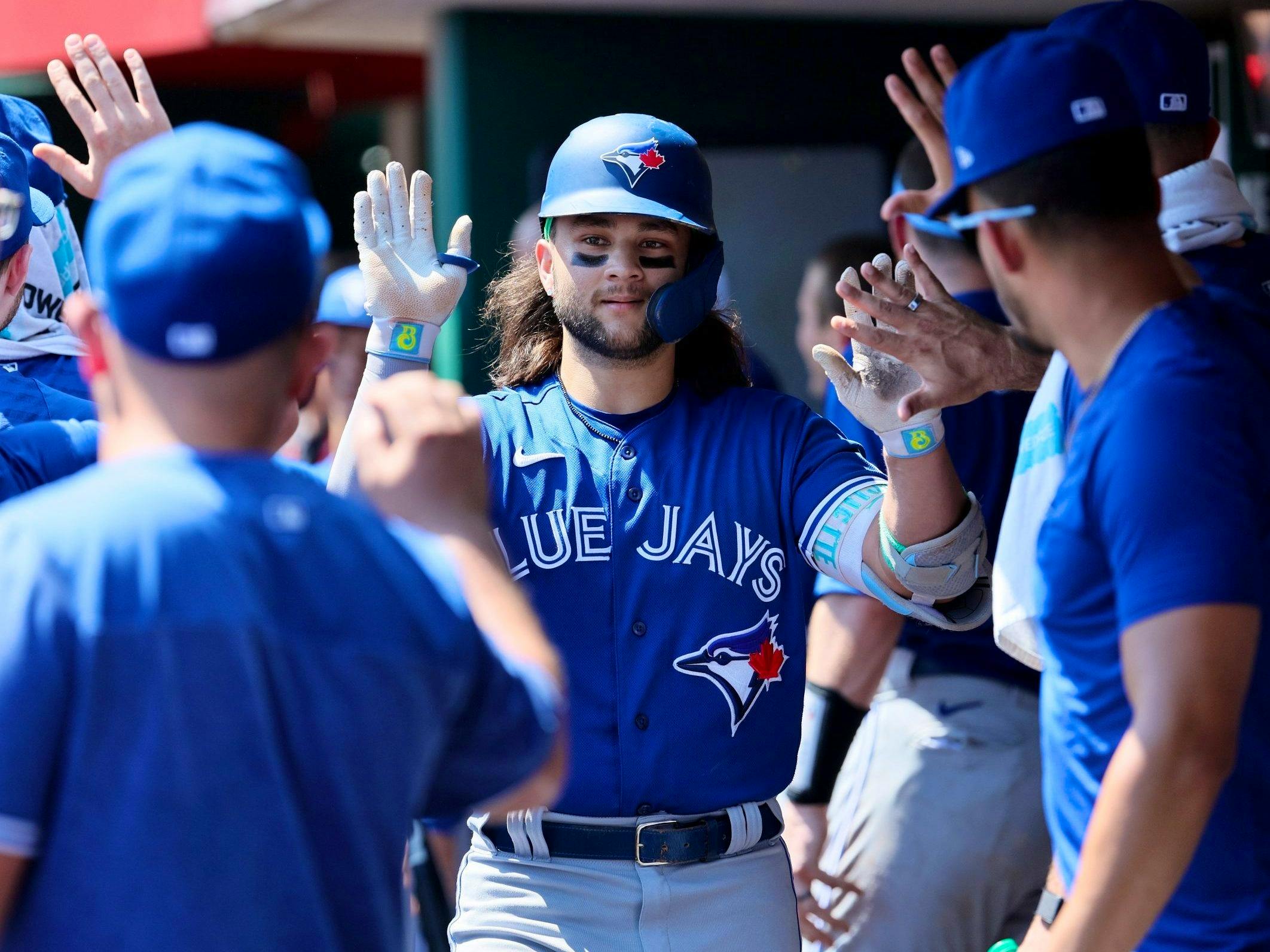 Bo Bichette of the Toronto Blue Jays celebrates his three run