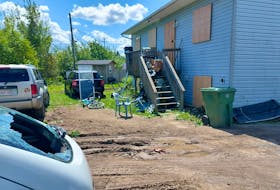 Following a big police operation on Bear Drive in Sitansisk (St. Mary’s First Nation) Sunday night, this home was boarded up. All three vehicles in the back yard had their windows smashed out.
