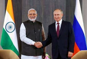 Russian President Vladimir Putin and Indian Prime Minister Narendra Modi attend a meeting on the sidelines of the Shanghai Cooperation Organization (SCO) summit in Samarkand, Uzbekistan Sept.16, 2022, where they discussed the planned expansion of the BRICS group of emerging economies — comprising India, Russia, China, Brazil and South Africa. Sputnik/Alexander Demyanchuk/Pool via REUTERS/File Photo