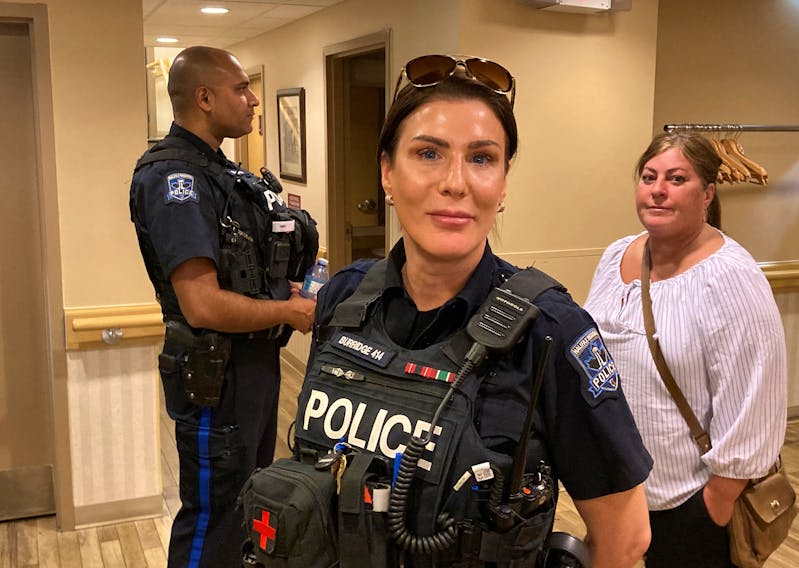 Const. Hannah Burridge of the Halifax Regional Police testified as a witness at a Nova Scotia Police Review Board hearing in Halifax on Tuesday. Const. Jason Wilson and Sgt. Darla Perry, president of the union that represents HRP members, are standing in the background. - FRANCIS CAMPBELL