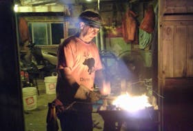 Philip Hurlburt, of Chebogue, which is just outside of Yarmouth, N.S., says summertime can be very hot working next to a coal fire so he often does some of his blacksmith work in the evenings. CONTRIBUTED