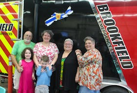 The Illsley family standing in front of one of Brookfield's fire trucks during the Come Home to Brookfield celebrations. Pictured is Glenn Illsley, Susan Naidene, Grace Illsley, Lisa Gado. Stella and William Naidene are in the front. Brendyn Creamer
