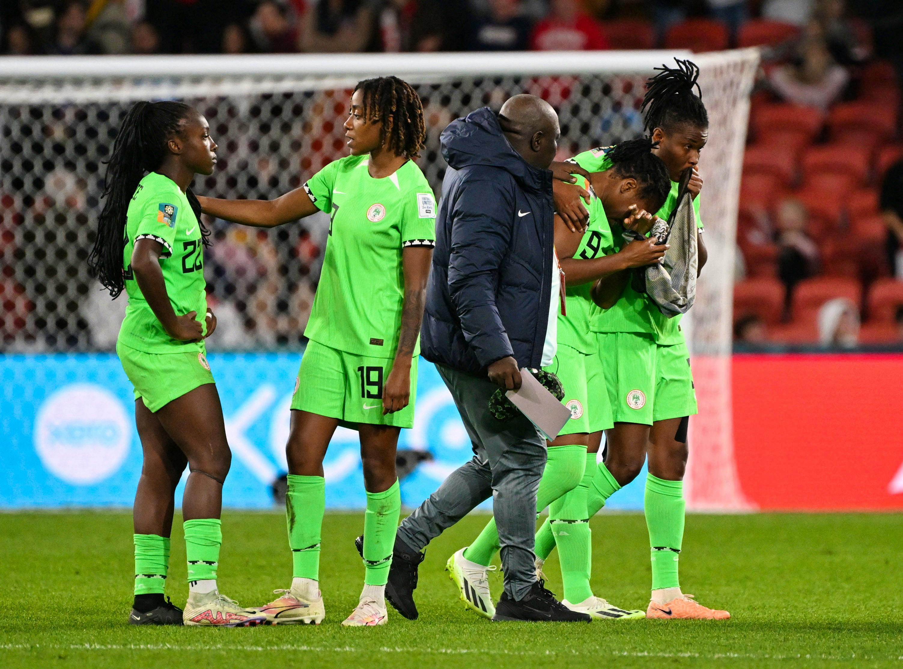 Soccer-Nigeria go home with heads held high after agonising exit