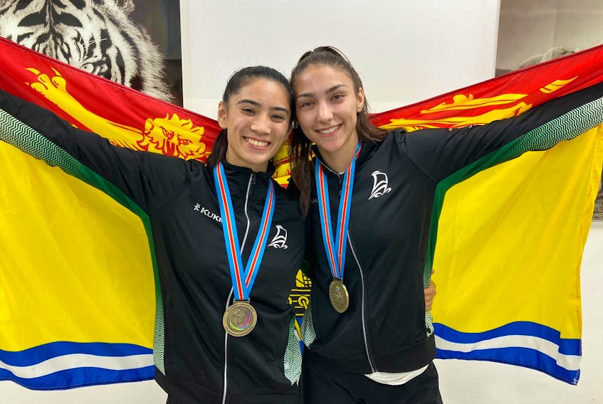 Fredericton wrestlers Vivian Kutnowski, left, and Elena Sehic won bronze medals in their weight categories at the Jeux de la Francophonie in Kinshasa, Democratic Republic of Congo. - Contributed